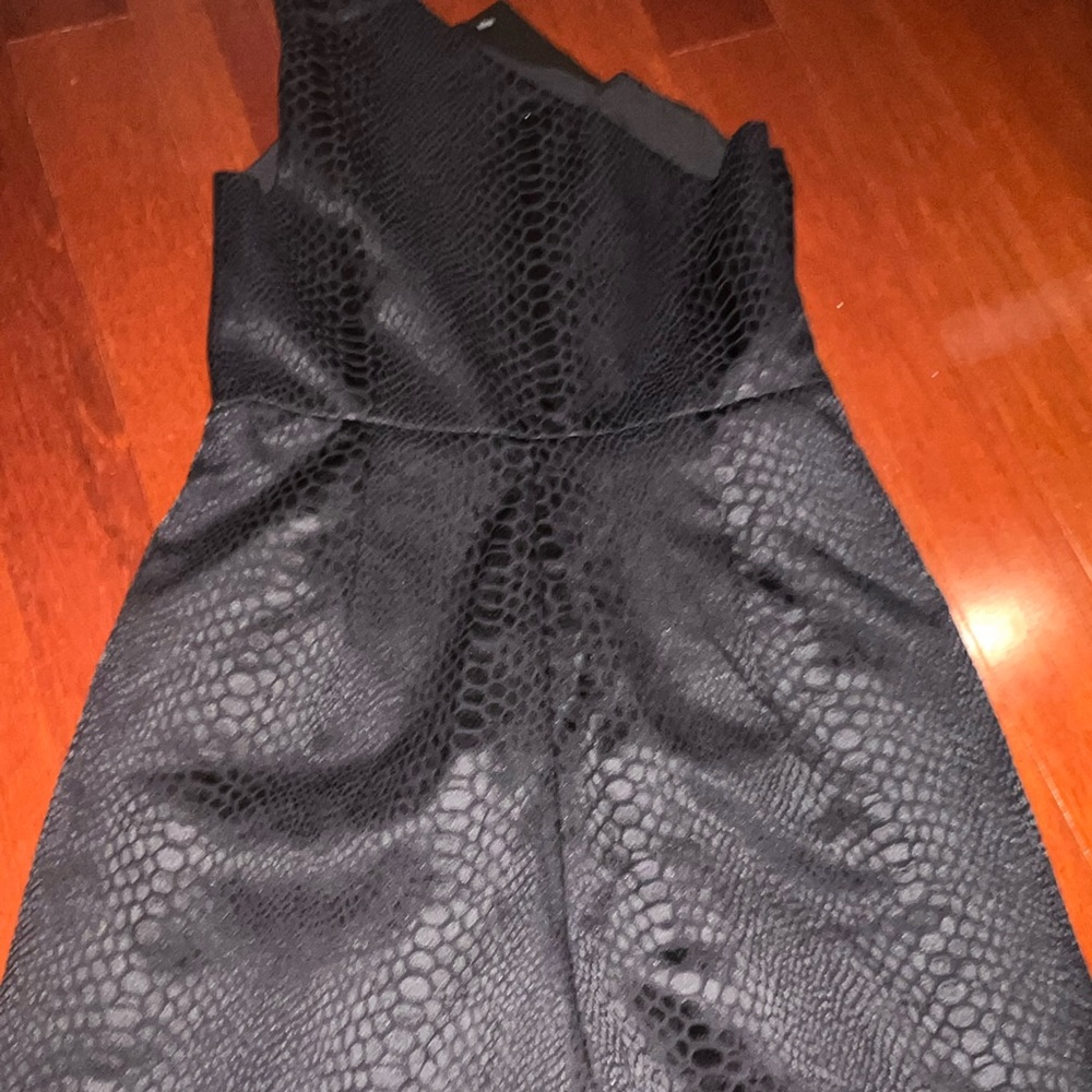 Black one shoulder romper from these three boutique